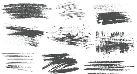 Nine dark grey textured brush stroke and splatter graphic elements on white background abstract artistic