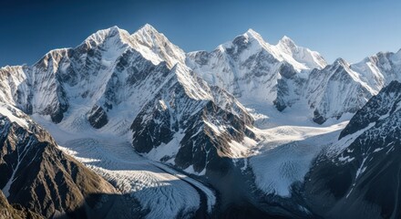Snow-capped mountain range under a clear, sunny blue sky