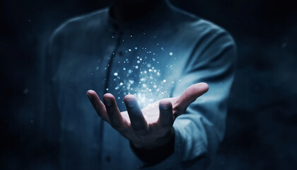 Mysterious man holding a glowing orb of shimmering particles symbolizing future technology