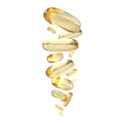 Yellow capsules levitate on a white background