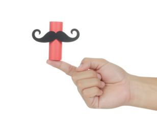 A hand holding a red cylinder topped with a black mustache, creating a playful and whimsical appearance.