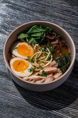 Ramen soup in cafe on wooden table. 