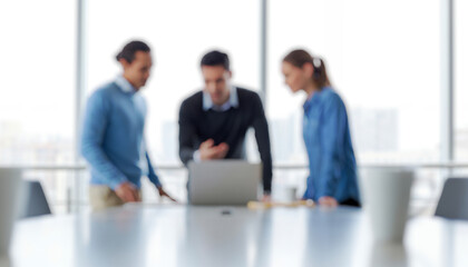 Obraz premium Three people collaborate around a laptop in a bright office setting, sharing ideas and working together in a modern professional workspace that emphasizes teamwork and productivity.