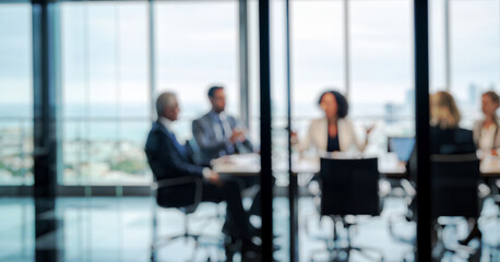 Blurred business people meeting in a high-rise conference room overlooking the city skyline, showing leadership, teamwork, and modern ambition in a bright professional environment.