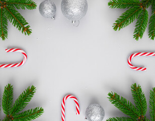 view holiday flat lay made from evergreen fir branches, sparkling baubles, candy  