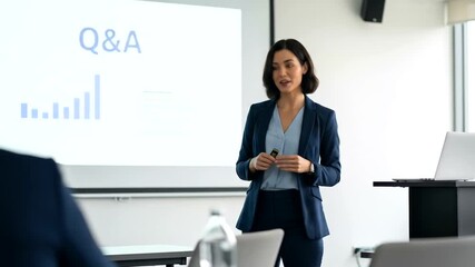 Professional woman delivering a presentation on Q&A session at a business conference or seminar or