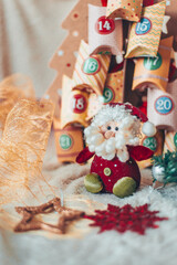Festive scene featuring a Santa toy with an advent calendar, embodying the Christmas spirit.