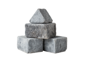 Stack of three gray, rough-hewn stone blocks on black