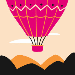 Hot Air Balloon Flying Above Mountains on a Sunny Day