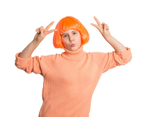Playful preteen girl in bright orange wig and sweater making peace signs with both hands, isolated on white. Perfect for fun, youth style, fashion, creativity, or social media concepts.