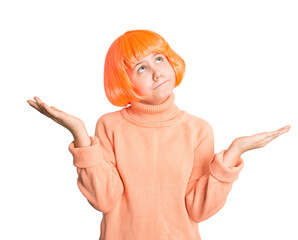 Preteen girl in bright orange wig and sweater shrugging shoulders and looking up, isolated on white. Perfect for confusion, doubt, question, uncertainty, or “I don’t know” concepts.