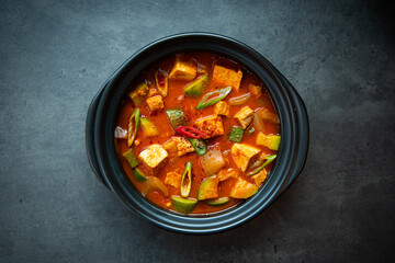 Hearty Korean Tofu and Vegetable Stew in a Black Pot