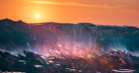 Clear shorebreak surfing wave at sunset of Hawaiian beach