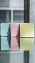 Three Colorful Sticky Notes On Glass Surface
