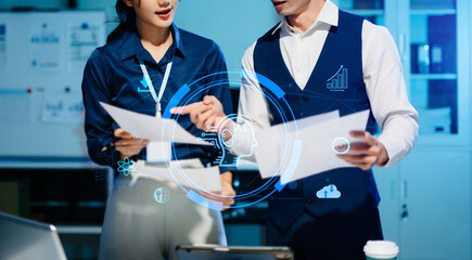 Asian business team analyzing data with AI technology, futuristic collaboration showing innovation, digital transformation, and modern teamwork