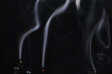 Obraz premium White clouds of vapor smoke are isolated on a black background. overlay
