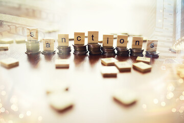 Economic sanctions against Russia because of Ukraine. Stacked coins on table. Multiple exposure city, dollar bills, judge hammer.