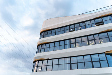 Fototapeta premium modern building with glass curtain walls and unique architectural design