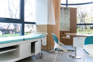 hospital examination room with a bed, desk