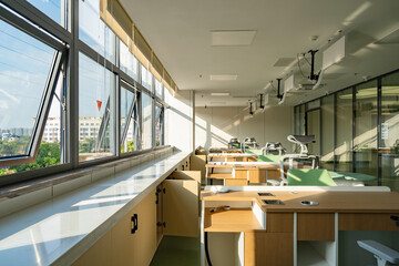 bright office in hospital with green furniture, large windows, and modern decor