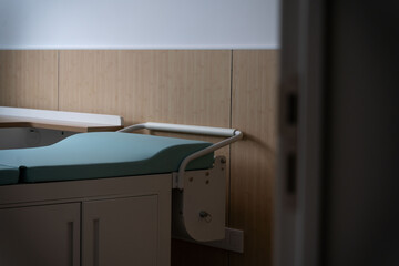 hospital examination room with a bed, desk