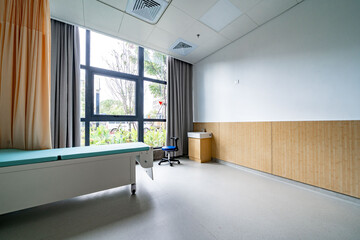 hospital examination room with a bed, desk