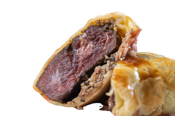 A sliced meat pie revealing its delicious fillings 