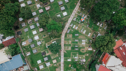 Central Walkway Through Lush Cemetery – Aerial View in Manila Memorial Park, Sucat, Parañaque, Metro Manila, Philippines Mid-shot