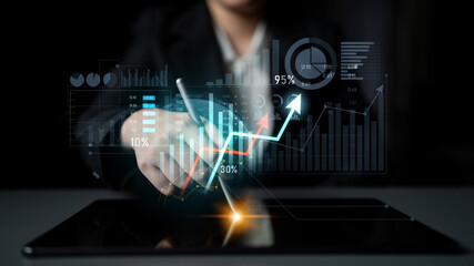 A business professional uses a digital tablet to analyze financial data, showcasing interactive graphs and charts that highlight growth trends and market insights. Scalp