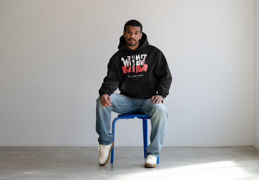Mockup Of Man Wearing Customized Hoodie, Sitting