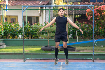 Asian Indonesian Man Doing Jumping Jack Exercise Outdoors