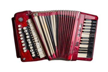 Close up of a red accordion keyboard isolated on transparent background. Red accordion with black and white keys isolated on white background.