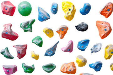 Collection of colorful climbing holds isolated on transparent background. Rock climbing wall with colorful rock climbing holds isolated on white background.