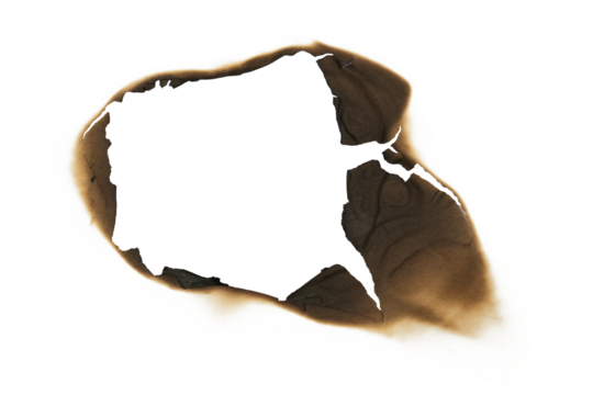burned hole in white paper background texture. Burn in paper with brown edges and flames isolated on a transparent background.