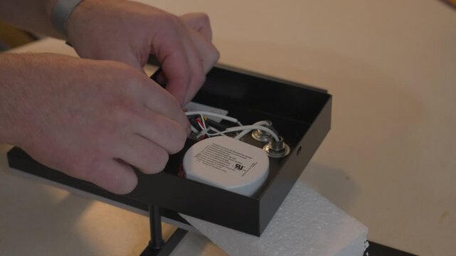Freeing up the bound wires from transit position.
