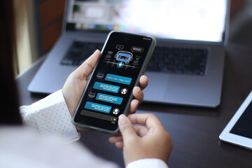Person using smartphone chatbot with AI conversation interface on screen, digital assistant, and messaging technology. Concept of artificial intelligence, automation, and customer service.