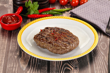Grilled beef burger cutlet with sauce