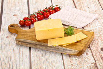 Yellow cheese piece with slices