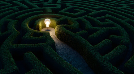A glowing lightbulb sits at the center of a sprawling, green maze, symbolizing an idea or solution within a complex problem