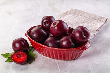 Raw ripe purple plum heap