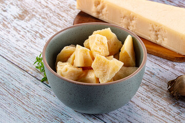 Parmesan cheese pieces in the bowl