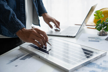 Engineer Design green energy technology with solar panel and wind turbine