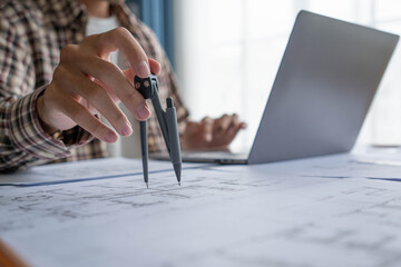 architect Interior Design working on building blueprint