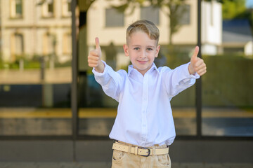 Happy boy showing thumbs up
