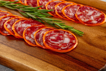 Spicy salami sausage in the cheese