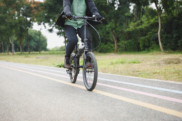 Woman riding bike at the bike lane
