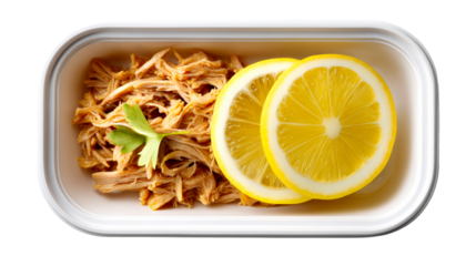 Shredded chicken in container with lemon slices and parsley garnish