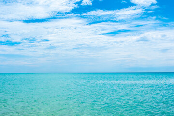 Nature of the ocean and blue sky Summer with sunshine, sandy beaches, clear blue waters sparkling against the blue sky. on an island with good ecology and environment Background for summer vacation