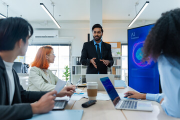 Diverse creative team use Ai Assistant (artificial intelligence assistant) on AI-assisted display for Marketing Data Analyst meeting at office.Coding team,develop Ai Assistant,business brainstorming