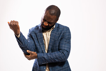 Portrait of tired and exhausted African-american businessman who is having pain in his elbow.